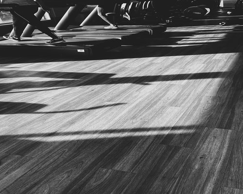 People doing dynamic movements in the gym space